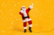 © deagreez - Full length photo of crazy overweight santa claus sing microphone christmas x-mas song on noel party wear headwear cap sunglass isolated over bright shine color background