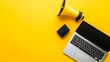 © Mr image - 3. A stylish flat lay of a laptop and a megaphone on a sunny yellow background, designed to create an engaging visual with generous copy space for advertisements
