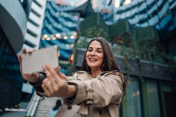 Happy businesswoman taking a selfie in the city