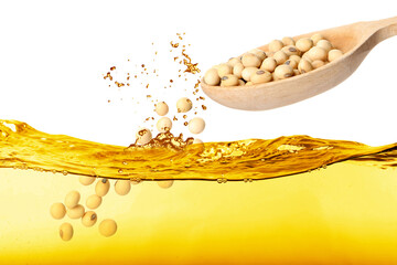 Poster - Soy beans falling from wooden spoon into vegetable oil on white background