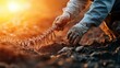 © pattaphorn - Paleontologist Uncovering Dinosaur Fossils in Sunlight