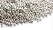 © suchetpong - High resolution close-up of pure silver granules on white background