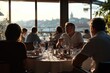 © Atlas Studio - Dinner Gathering at a Riverside Restaurant During Sunset With Guests Enjoying Conversation and a Cozy Atmosphere