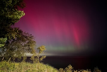 Northern lights over Lake Michigan from Beverly Shores, Indiana USA October 10, 2024