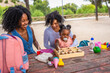 © unai - Granny, mother and girl playing with toys in the park
