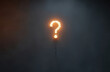 © Alena - burning question marks in a dark room.
