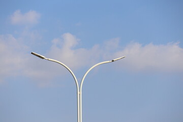 street lamp against blue sky	
