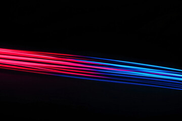 Technological background. Red and blue lines on black background, reminiscent of wires.