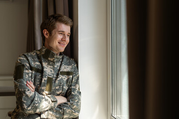 Portrait of caucasian soldier in uniform smiling