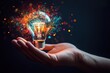 © volga - Creative spark glowing lightbulb in hand with magical sparks