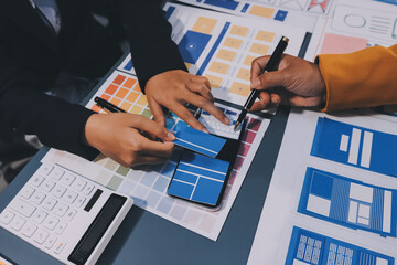 The designer team is designing the uxui system to make the uxui system work well on new phones and support system updates. Website development concept UI UX front end designer
