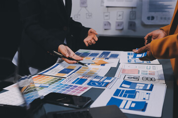 The designer team is designing the uxui system to make the uxui system work well on new phones and support system updates. Website development concept UI UX front end designer