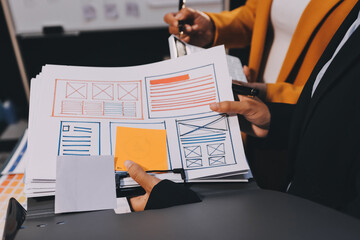 The designer team is designing the uxui system to make the uxui system work well on new phones and support system updates. Website development concept UI UX front end designer