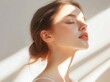 © ryker - serene woman with healthy, glowing skin enjoys soft light illuminating her features, creating peaceful and radiant atmosphere