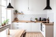 © Vooglo.com - A small but stylish kitchen space featuring white cabinets, wooden countertops, and a light wood