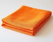 © Vlad - Orange Napkin. Folded Cotton Cloth Placemat in Plain Square Shape