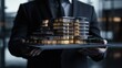 © putri syakilla - A businessman presents a scale model of a modern architectural building.