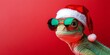© Corri Seizinger - Merry Christmas concept holiday vacation winter animal pet greeting card - Cool chameleon with sunglasses and santa claus hat, isolated on red background