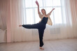 © Михаил Решетников - Caucasian woman dancing contemporary in ballet class. Rehearsal.