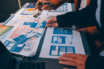 The designer team is designing the uxui system to make the uxui system work well on new phones and support system updates. Website development concept UI UX front end designer