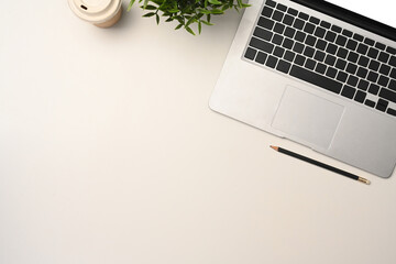 Poster - Top view laptop computer, paper cup of coffee and houseplant on white table