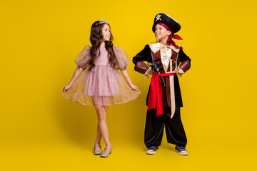 Canvas Print - Full size photo of two little kids wear halloween pirate princess costume isolated on yellow color background