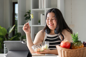 Young Woman Enjoying a Healthy Salad for Wellness and Nutrition at Home