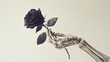 © Nadin Faust - minimalistic monochrome skeleton hand holding a black rose in a surrealistic and vintage photographic style