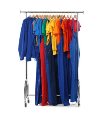 Wall Mural - Different workers' uniforms on clothing rack isolated on white