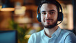 © Prasanth - Portrait, call center and man consulting with headphones for customer service, help or telemarketing. Happy, confident and consultant agent talking with headset for support, sales or online advice