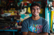 © wolfhound911 - A joyful young Brazilian technician with a wrench in hand poses in a colorful workshop. His approachable smile and enthusiasm for his work create a positive impression, highlighting his dedication to