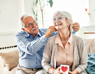 Wall Mural - gift woman man couple happy love present senior elderly necklace jewellery luxury jewelry accessory 