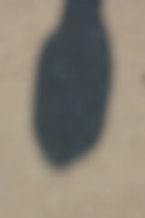 Wall Mural - a vague view of a concrete sidewalk with a shadow.