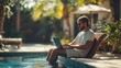 © liliyabatyrova - A man is sitting in a pool with a laptop on his lap