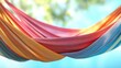 © ALIS ST - A colorful hammock swaying in the summer breeze, with room for copy in the background