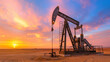 © crazyass - Desert Oil Pump at Sunset, an industrial oil pump silhouetted against a vibrant sunset sky, showcasing the intersection of energy production and natural beauty in a remote landscape