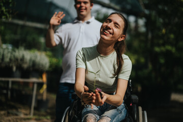 A happy young woman in a wheelchair smiles while holding a plant, accompanied by a friend outdoors. Captures joy, inclusion, and friendship in a natural setting.