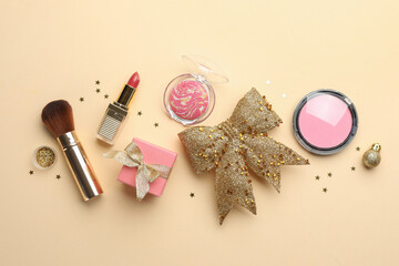 Poster - Flat lay composition with makeup products and Christmas decor on beige background