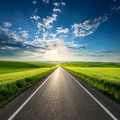 Wall Mural - asphalt road in green fields under beautiful sky