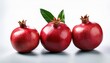 © Heaven - three ripe pomegranate fruit with green leaf