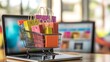 © DYNECREATIVE - Shopping cart with colorful bags and boxes in front of a laptop, representing online shopping, e-commerce, and digital retail services.
