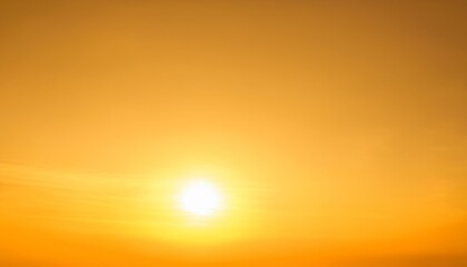 early sunshine in a clear yellow sky nature background glowing light on heavenly orange backdrop shi