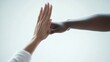 © Lion - Close-up of two colleagues exchanging a high five, minimal background focusing on the action.