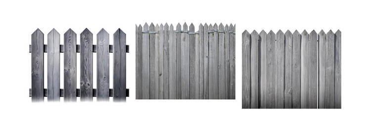 Poster - A weathered gray wooden fence with pointed top slats