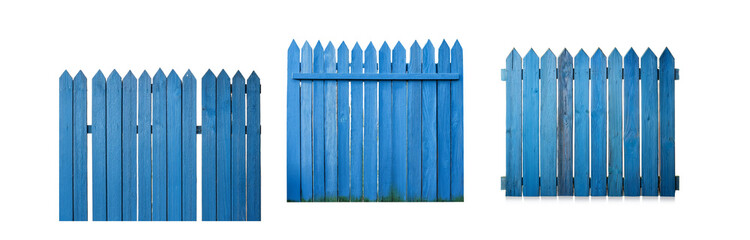 Poster - Three sections of a blue wooden fence with pointed top planks.