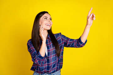 Wall Mural - Photo portrait of pretty young girl look touch empty space wear trendy plaid outfit isolated on yellow color background