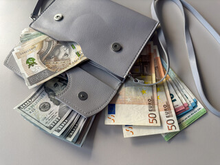 zloty pln zl euro and us dollar money in purse wallet on desk. Saving or shopping concept