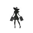© Dream House - A young woman with long hair wearing a polka dot dress, holding shopping bags