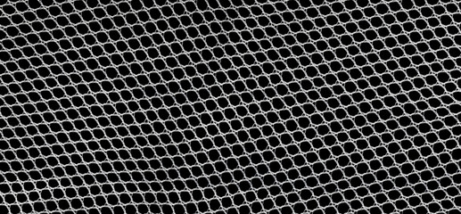 White lace mesh closeup isolated on a black background