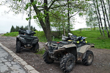 Mountain landscape with two ATVs equipped for work temporarily parked, Vitosha Mountain, Bulgaria 